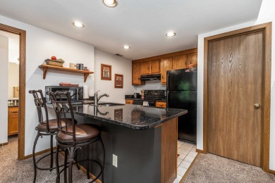 Bright and airy 2 bed, 2 bath Oak Glen Golf Villa perched in a on Eagle Ridge Inn and Resort in Illinois - for sale on GolfHomes.com, golf home, golf lot