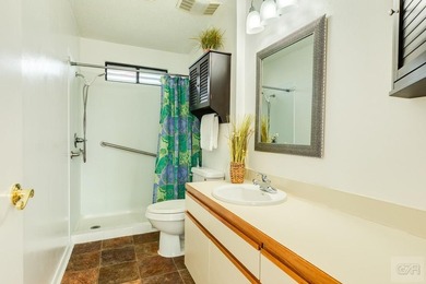 CHARMING THREE-BEDROOM CANAL HOME IN JAMAICA BEACH has a on Galveston Country Club in Texas - for sale on GolfHomes.com, golf home, golf lot