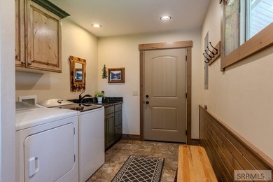 Modern Mountain Escape on the Golf Course! Experience mountain on Island Park Village Resort Golf Course in Idaho - for sale on GolfHomes.com, golf home, golf lot