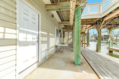 CHARMING THREE-BEDROOM CANAL HOME IN JAMAICA BEACH has a on Galveston Country Club in Texas - for sale on GolfHomes.com, golf home, golf lot