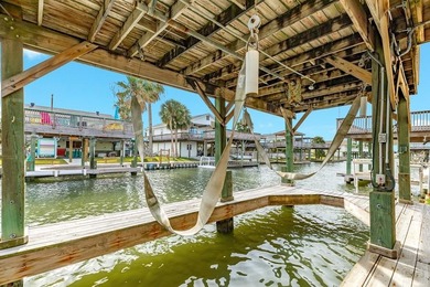 CHARMING THREE-BEDROOM CANAL HOME IN JAMAICA BEACH has a on Galveston Country Club in Texas - for sale on GolfHomes.com, golf home, golf lot