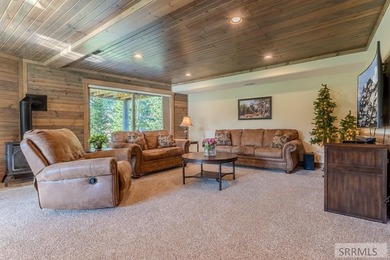 Modern Mountain Escape on the Golf Course! Experience mountain on Island Park Village Resort Golf Course in Idaho - for sale on GolfHomes.com, golf home, golf lot