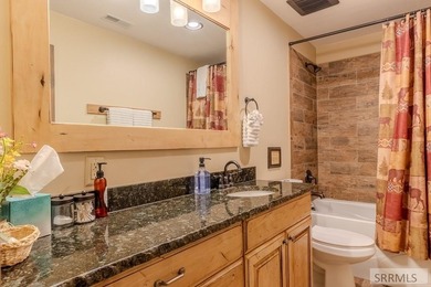 Modern Mountain Escape on the Golf Course! Experience mountain on Island Park Village Resort Golf Course in Idaho - for sale on GolfHomes.com, golf home, golf lot