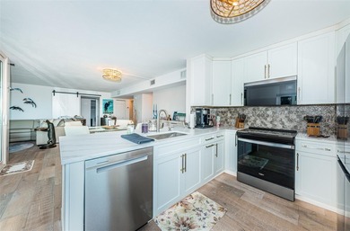 Enjoy spectacular views of Boca Ciega Bay from the moment you on Isla Del Sol Yacht and Country Club in Florida - for sale on GolfHomes.com, golf home, golf lot