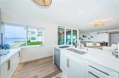 Enjoy spectacular views of Boca Ciega Bay from the moment you on Isla Del Sol Yacht and Country Club in Florida - for sale on GolfHomes.com, golf home, golf lot