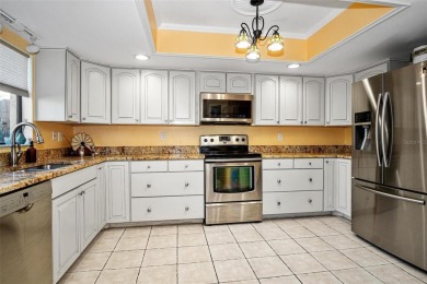 This home is situated in a quiet neighborhood in Sun City Center on Caloosa Greens Executive Golf Course in Florida - for sale on GolfHomes.com, golf home, golf lot