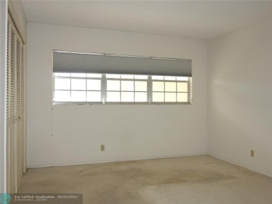 Spacious 2-Bed, 2-Bath Condo with Golf Course Views. Enjoy on Palm-Aire Country Club and Resort - Palms in Florida - for sale on GolfHomes.com, golf home, golf lot