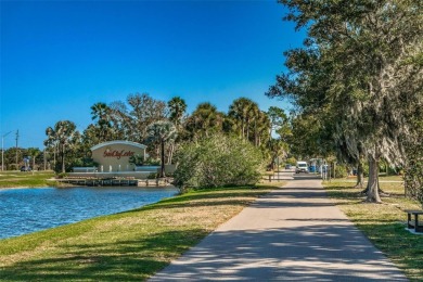 This home is situated in a quiet neighborhood in Sun City Center on Caloosa Greens Executive Golf Course in Florida - for sale on GolfHomes.com, golf home, golf lot