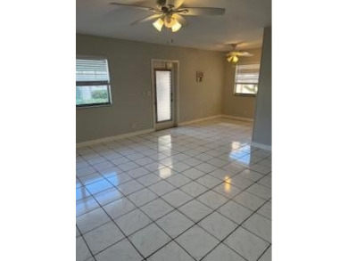 Charming Single-Story Residence with Breathtaking Water Views in on Kings Point Golf - Executive in Florida - for sale on GolfHomes.com, golf home, golf lot
