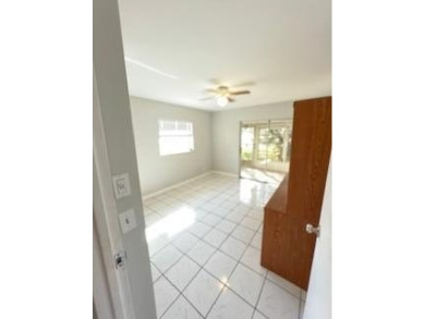 Charming Single-Story Residence with Breathtaking Water Views in on Kings Point Golf - Executive in Florida - for sale on GolfHomes.com, golf home, golf lot