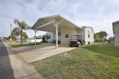 This TRIPLE-wide Palm Harbor home is situated on a spacious on Maple Leaf Golf and Country Club in Florida - for sale on GolfHomes.com, golf home, golf lot