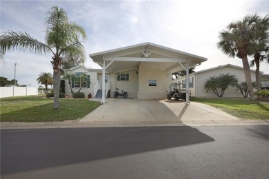 This TRIPLE-wide Palm Harbor home is situated on a spacious on Maple Leaf Golf and Country Club in Florida - for sale on GolfHomes.com, golf home, golf lot