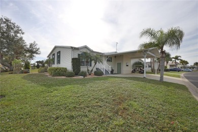 This TRIPLE-wide Palm Harbor home is situated on a spacious on Maple Leaf Golf and Country Club in Florida - for sale on GolfHomes.com, golf home, golf lot