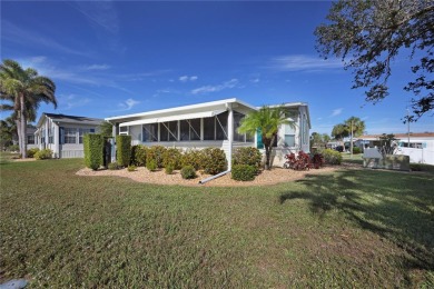 This TRIPLE-wide Palm Harbor home is situated on a spacious on Maple Leaf Golf and Country Club in Florida - for sale on GolfHomes.com, golf home, golf lot