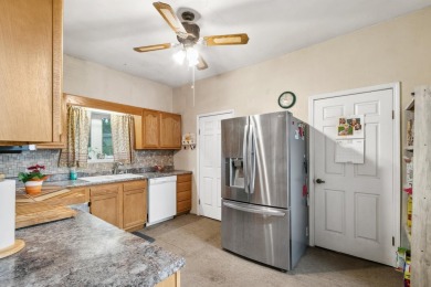 Step into a piece of history with this enchanting 1880s-era home on Mayville Golf Club in Wisconsin - for sale on GolfHomes.com, golf home, golf lot