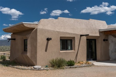 Live inside a work of art in this Artist's Dream Dwelling in on Taos Country Club in New Mexico - for sale on GolfHomes.com, golf home, golf lot