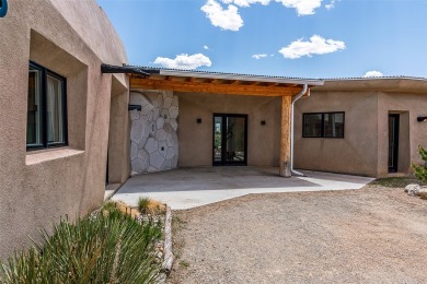Live inside a work of art in this Artist's Dream Dwelling in on Taos Country Club in New Mexico - for sale on GolfHomes.com, golf home, golf lot