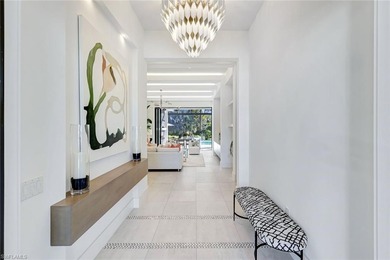 ELEVATED & LUXURIOUS This is a rare opportunity to own a on The Golf Club At Fiddlers Creek in Florida - for sale on GolfHomes.com, golf home, golf lot