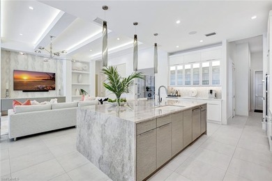 ELEVATED & LUXURIOUS This is a rare opportunity to own a on The Golf Club At Fiddlers Creek in Florida - for sale on GolfHomes.com, golf home, golf lot