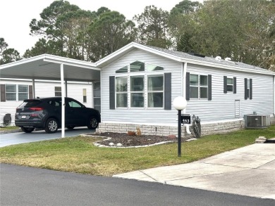 NEW ROOF JANUARY, 2025! AND NEW PLUMBING UPGRADE!  This is a on Lily Lake Golf and RV Resort in Florida - for sale on GolfHomes.com, golf home, golf lot