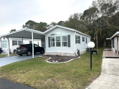 NEW ROOF JANUARY, 2025! AND NEW PLUMBING UPGRADE!  This is a on Lily Lake Golf and RV Resort in Florida - for sale on GolfHomes.com, golf home, golf lot