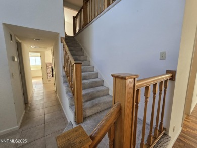 Imagine a charming two-story family home nestled in a serene on LakeRidge Golf Course in Nevada - for sale on GolfHomes.com, golf home, golf lot