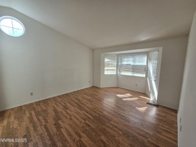 Imagine a charming two-story family home nestled in a serene on LakeRidge Golf Course in Nevada - for sale on GolfHomes.com, golf home, golf lot