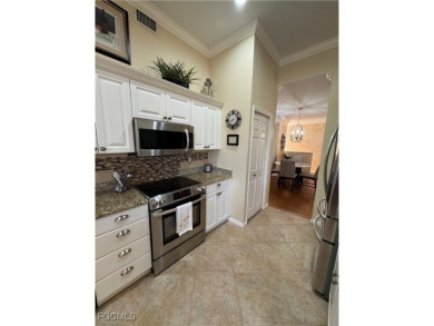 Luxurious coach home with gorgeous settings in Glen Eagle Golf on Glen Eagle Golf and Country Club in Florida - for sale on GolfHomes.com, golf home, golf lot