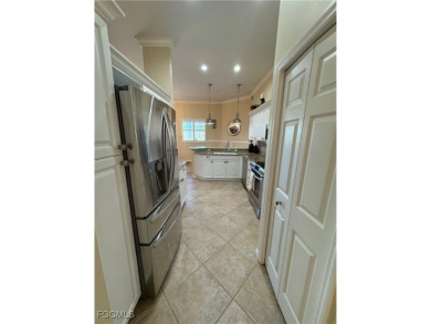Luxurious coach home with gorgeous settings in Glen Eagle Golf on Glen Eagle Golf and Country Club in Florida - for sale on GolfHomes.com, golf home, golf lot