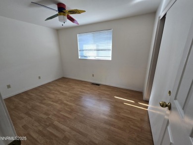 Imagine a charming two-story family home nestled in a serene on LakeRidge Golf Course in Nevada - for sale on GolfHomes.com, golf home, golf lot
