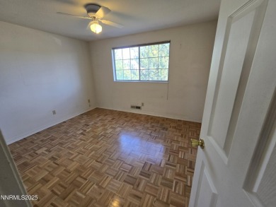 Imagine a charming two-story family home nestled in a serene on LakeRidge Golf Course in Nevada - for sale on GolfHomes.com, golf home, golf lot