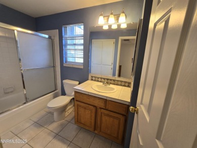 Imagine a charming two-story family home nestled in a serene on LakeRidge Golf Course in Nevada - for sale on GolfHomes.com, golf home, golf lot