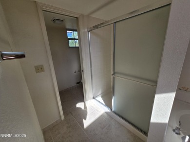 Imagine a charming two-story family home nestled in a serene on LakeRidge Golf Course in Nevada - for sale on GolfHomes.com, golf home, golf lot