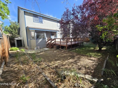 Imagine a charming two-story family home nestled in a serene on LakeRidge Golf Course in Nevada - for sale on GolfHomes.com, golf home, golf lot