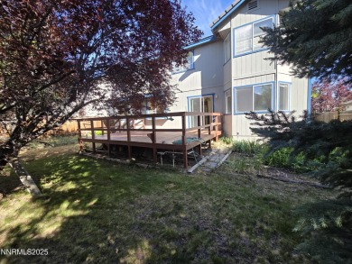 Imagine a charming two-story family home nestled in a serene on LakeRidge Golf Course in Nevada - for sale on GolfHomes.com, golf home, golf lot