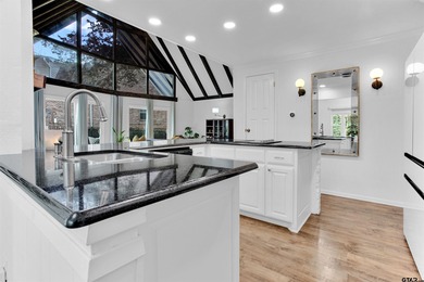 LOCATION, CHARM, AND FULL GUEST HOUSE. Nestled at the end of a on Hide-A-Way Lake Golf Course in Texas - for sale on GolfHomes.com, golf home, golf lot