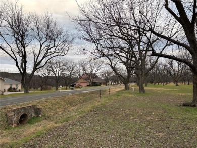 Welcome to this stunning 1.505-acre lot located in the gated on Pecan Plantation Country Club in Texas - for sale on GolfHomes.com, golf home, golf lot