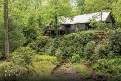Discover this Holly Forest home in a one-of-a-kind setting on Sapphire National Golf Club in North Carolina - for sale on GolfHomes.com, golf home, golf lot