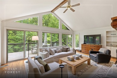 Discover this Holly Forest home in a one-of-a-kind setting on Sapphire National Golf Club in North Carolina - for sale on GolfHomes.com, golf home, golf lot