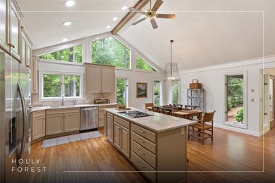 Discover this Holly Forest home in a one-of-a-kind setting on Sapphire National Golf Club in North Carolina - for sale on GolfHomes.com, golf home, golf lot