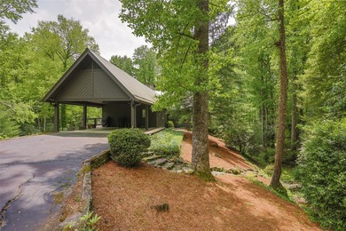 Discover this Holly Forest home in a one-of-a-kind setting on Sapphire National Golf Club in North Carolina - for sale on GolfHomes.com, golf home, golf lot