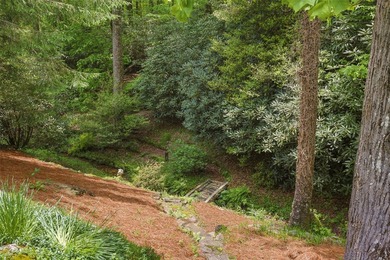 Discover this Holly Forest home in a one-of-a-kind setting on Sapphire National Golf Club in North Carolina - for sale on GolfHomes.com, golf home, golf lot