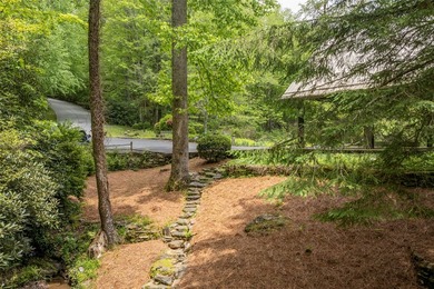 Discover this Holly Forest home in a one-of-a-kind setting on Sapphire National Golf Club in North Carolina - for sale on GolfHomes.com, golf home, golf lot