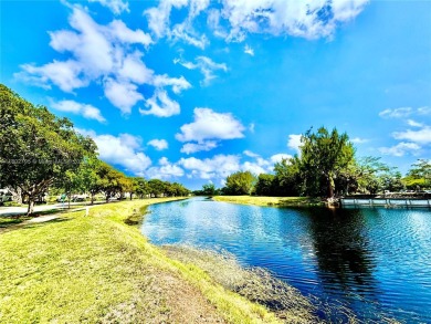 Welcome home to this warm and inviting, FULLY FURNISHED TURNKEY on Palm-Aire Country Club and Resort - Palms in Florida - for sale on GolfHomes.com, golf home, golf lot