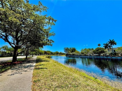 Welcome home to this warm and inviting, FULLY FURNISHED TURNKEY on Palm-Aire Country Club and Resort - Palms in Florida - for sale on GolfHomes.com, golf home, golf lot