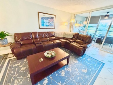 Welcome home to this warm and inviting, FULLY FURNISHED TURNKEY on Palm-Aire Country Club and Resort - Palms in Florida - for sale on GolfHomes.com, golf home, golf lot