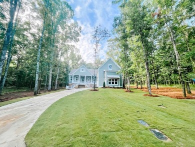 Situated on a spacious nearly 1-acre scenic wooded lot nestled on Wynlakes Golf and Country Club in Alabama - for sale on GolfHomes.com, golf home, golf lot