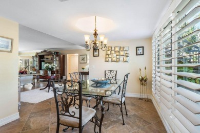 Enjoy picturesque views of the lush golf course and serene on Quail Ridge Golf Course and Country Club in Florida - for sale on GolfHomes.com, golf home, golf lot
