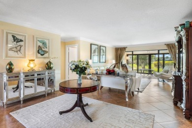 Enjoy picturesque views of the lush golf course and serene on Quail Ridge Golf Course and Country Club in Florida - for sale on GolfHomes.com, golf home, golf lot
