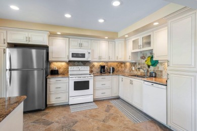 Enjoy picturesque views of the lush golf course and serene on Quail Ridge Golf Course and Country Club in Florida - for sale on GolfHomes.com, golf home, golf lot